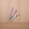 The pink hair straightener features a constant-temperature ceramic straight plate and is a dual-purpose household hair care tool for curling and straightening hair Application Scenario